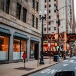 a city street with tall buildings and a traffic light